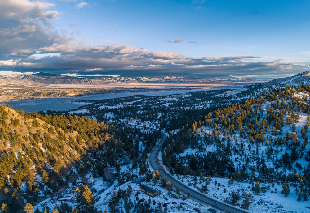 an aerial view of a road in the mountains