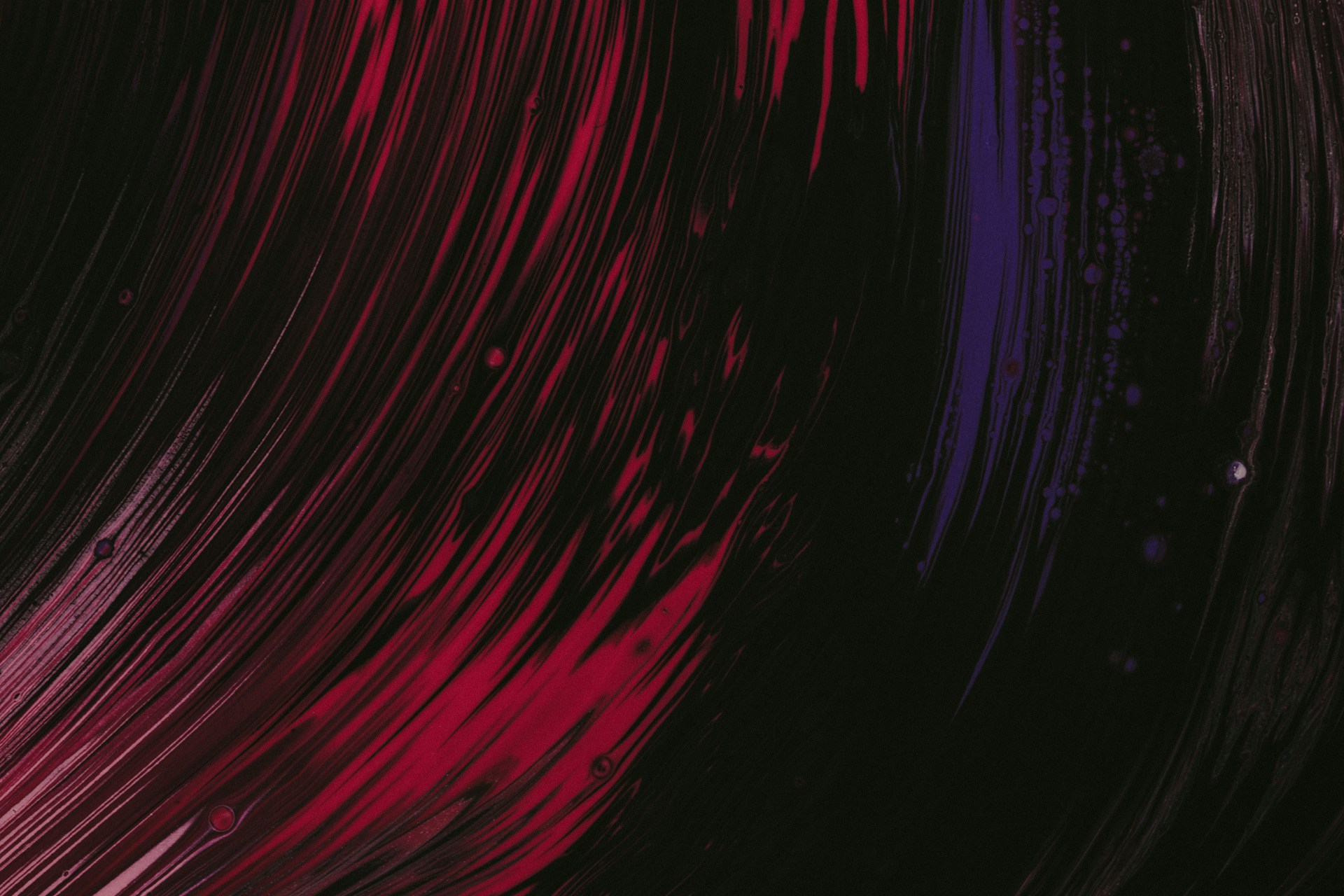 a red and purple background with a black background