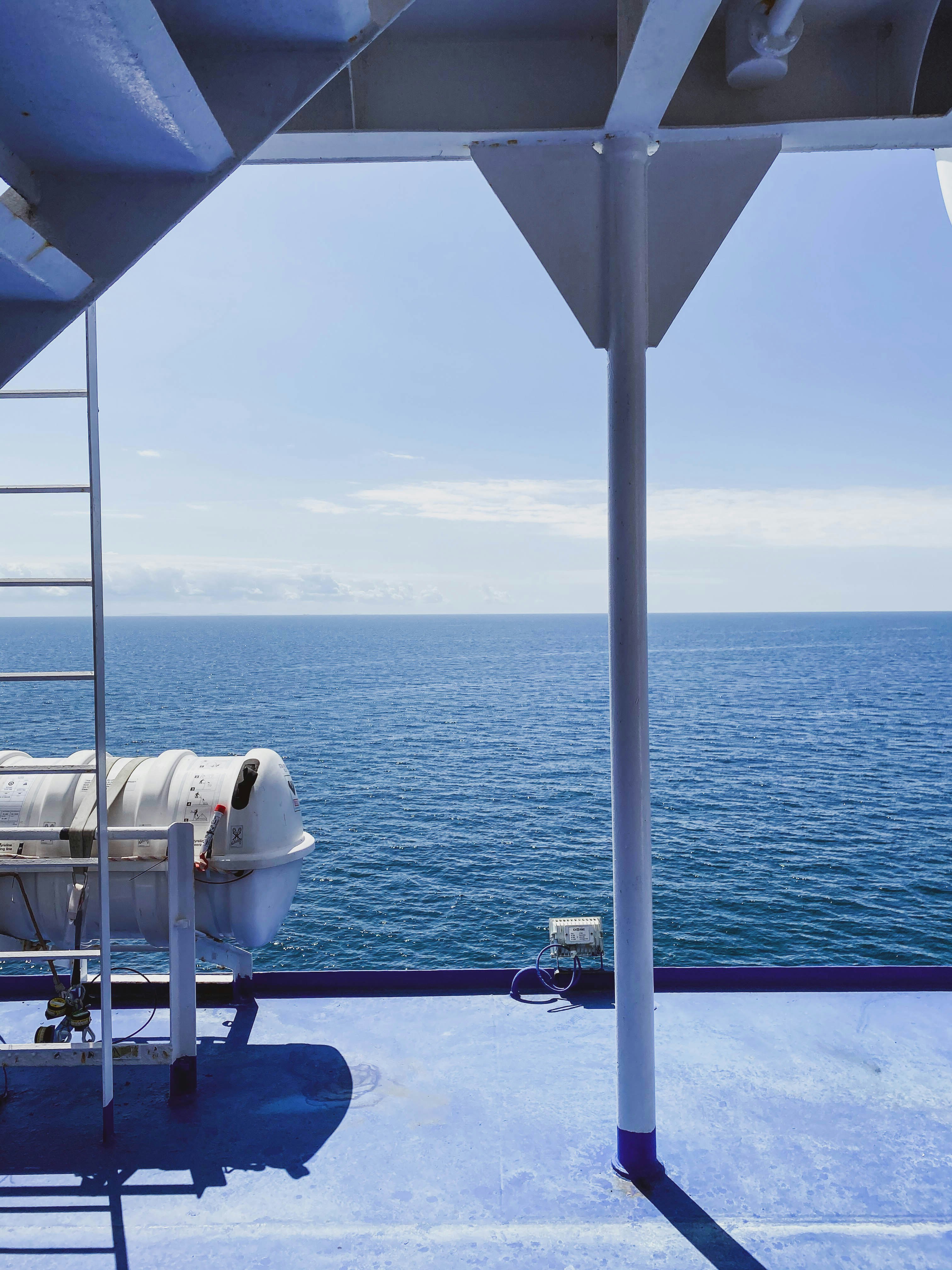 Luxury cruise ship sailing on a calm blue ocean under a clear sky