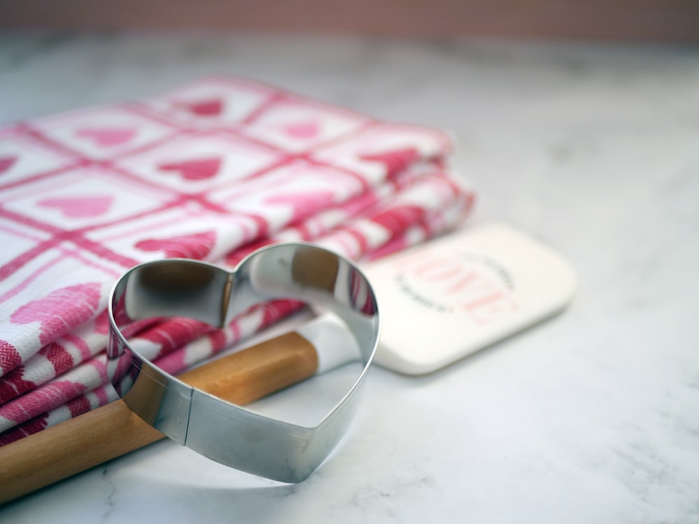 a cookie cutter sitting on top of a table next to a towel