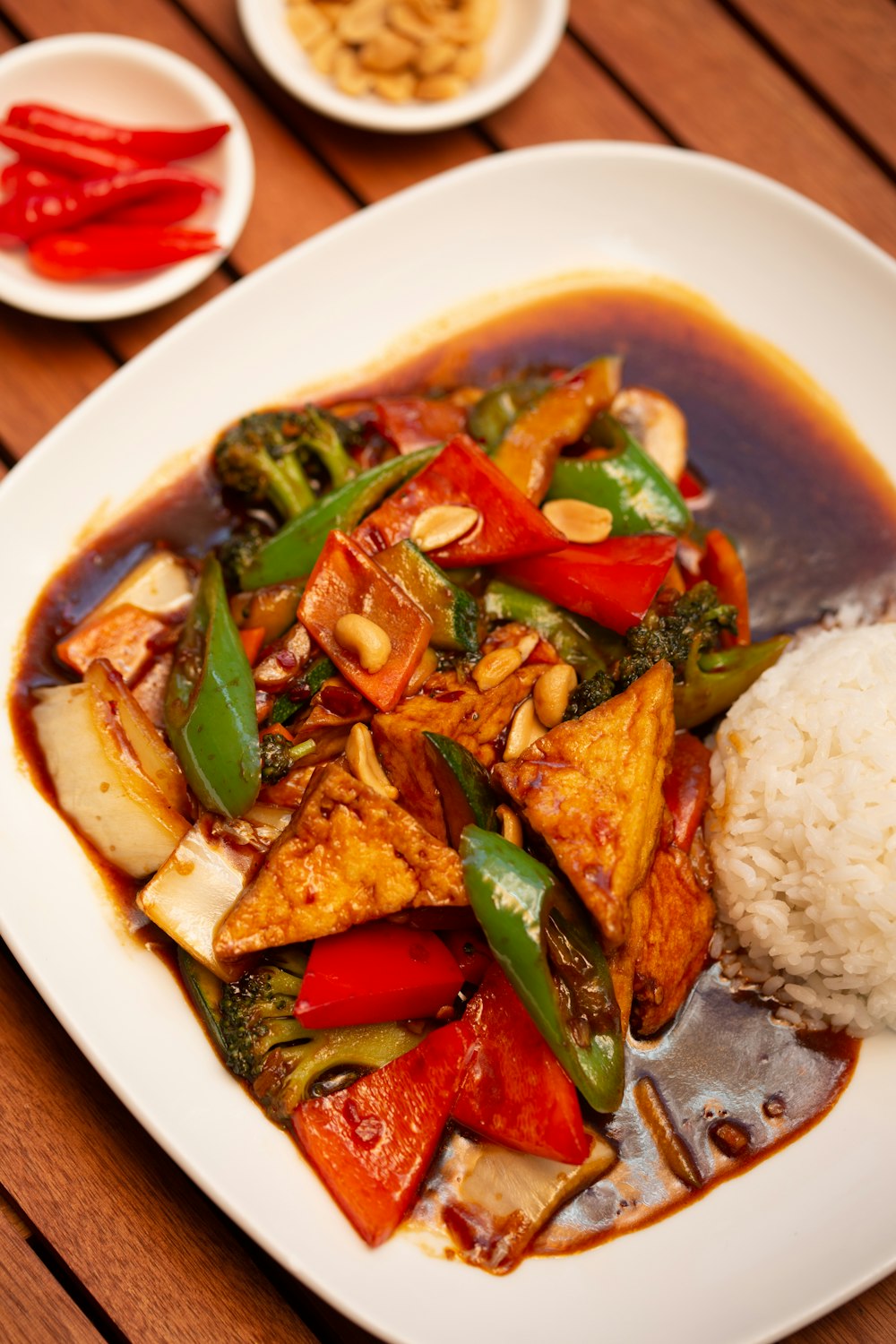 a white plate topped with rice and vegetables