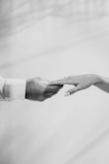 Close-up of hands exchanging a business card during a job interview