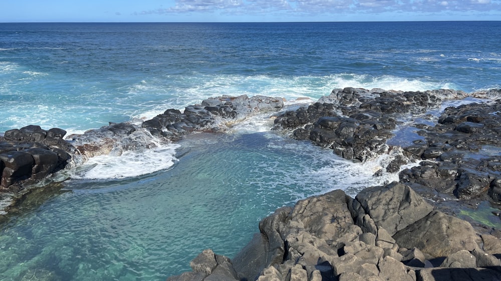 a large body of water surrounded by rocks