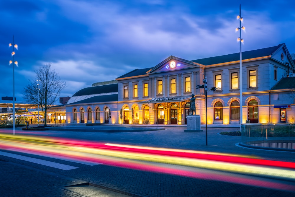 a large white building with a clock on it's face