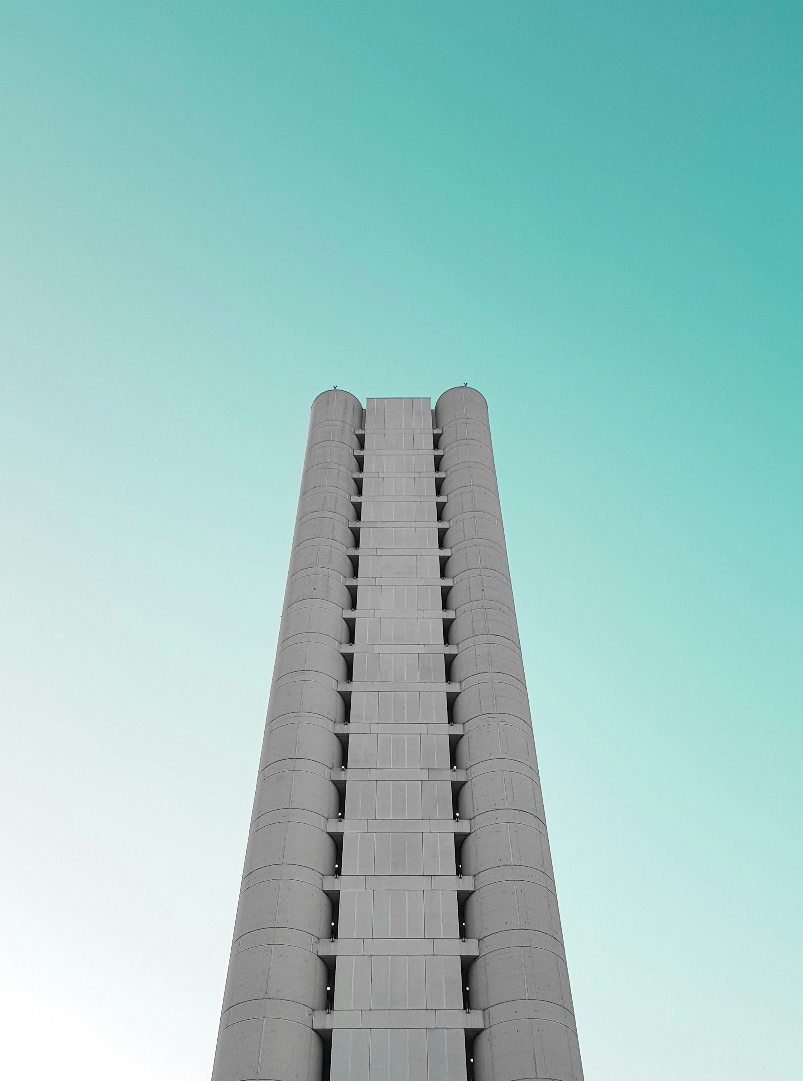 a very tall building with a clock on it's side