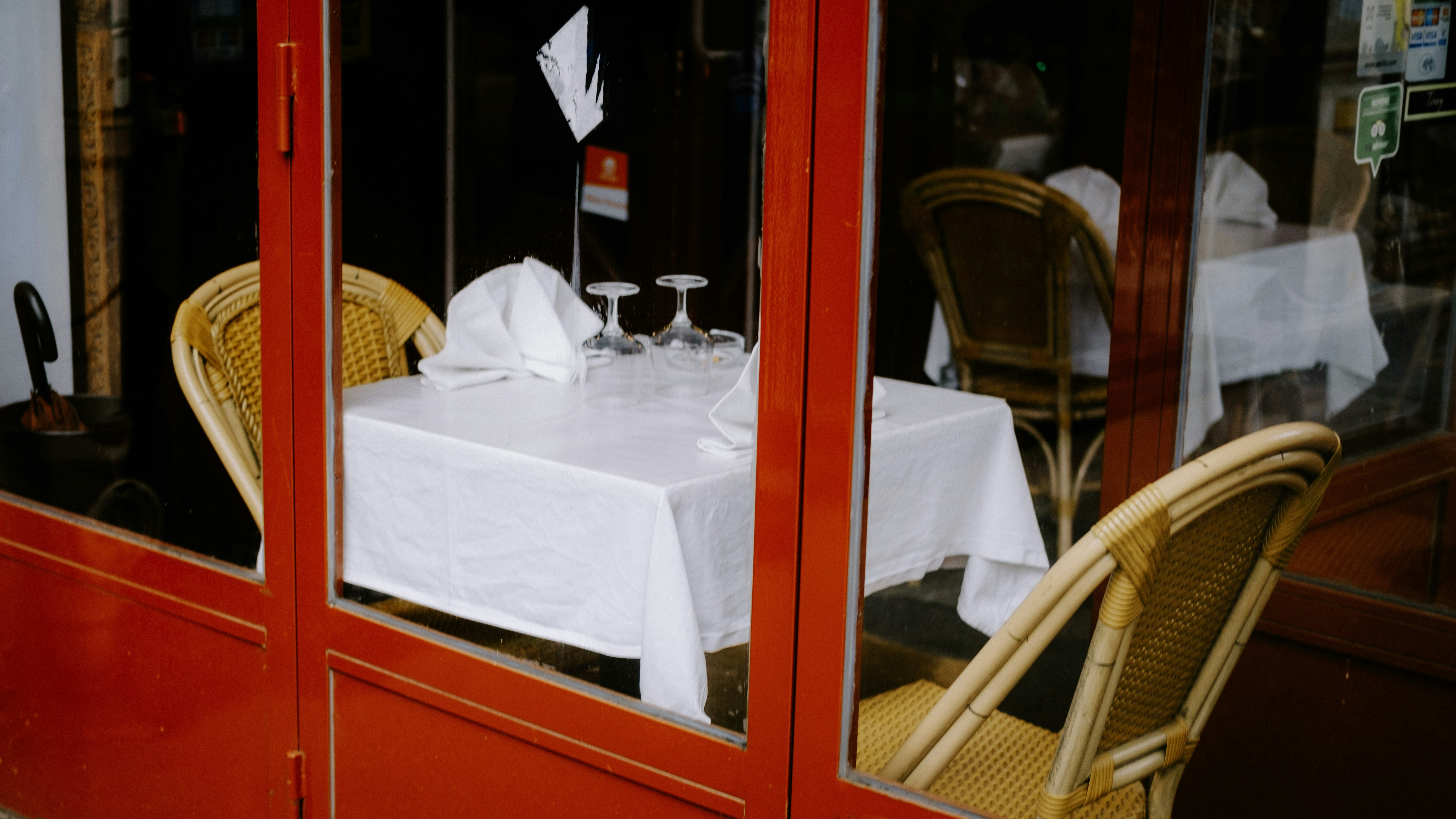 a table with two chairs and a white table cloth