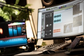 a computer monitor sitting on top of a desk