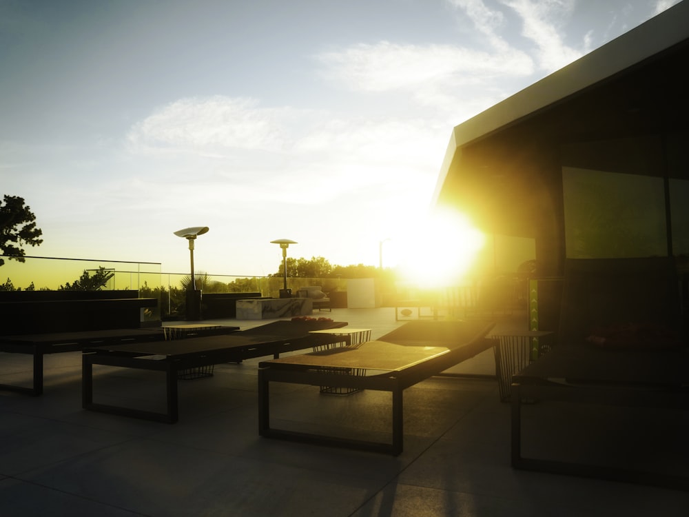 the sun is setting over a skate park