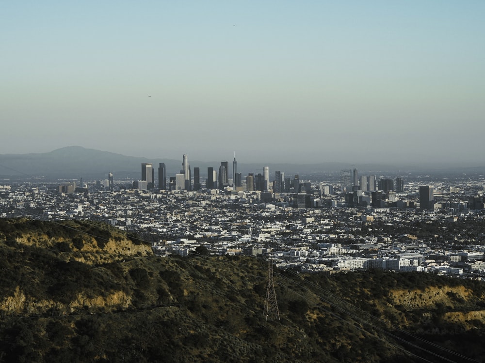 a view of a city from the top of a hill