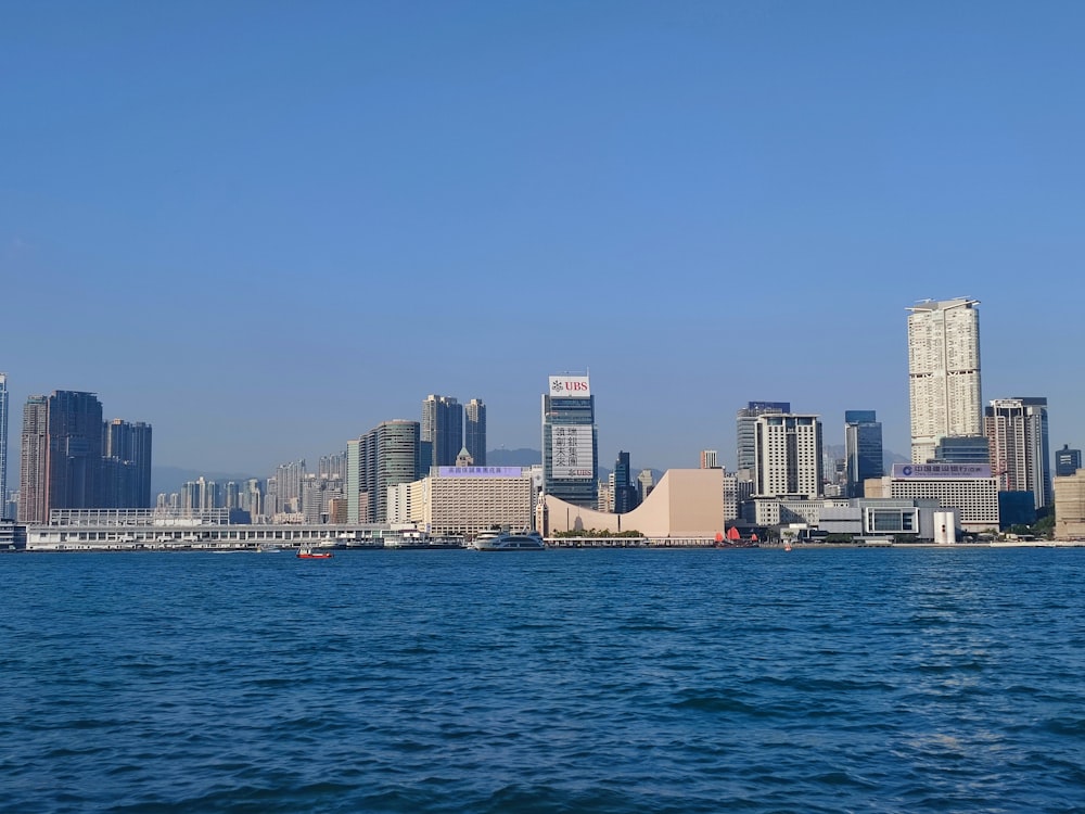 a large body of water with a city in the background