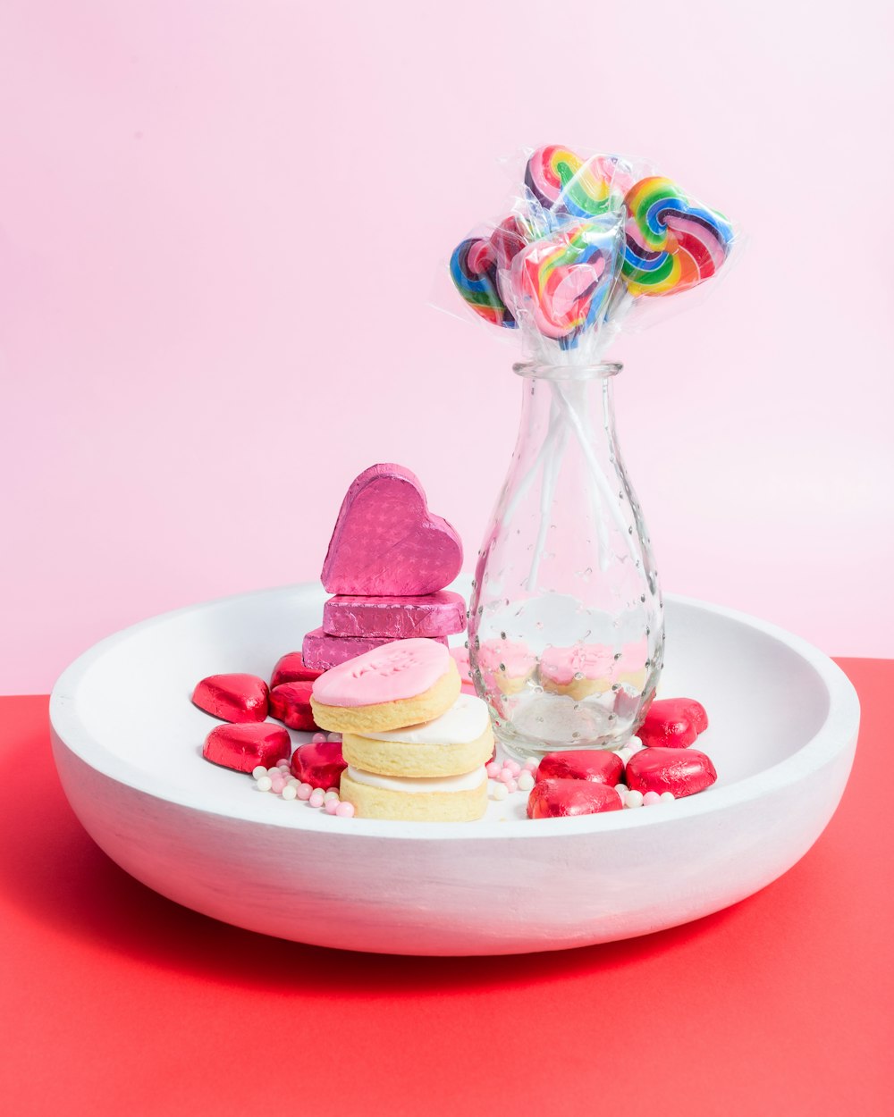 a white plate topped with cookies and candy