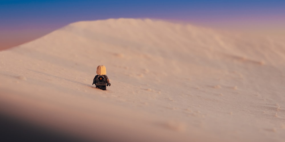 a person with a backpack walking up a hill