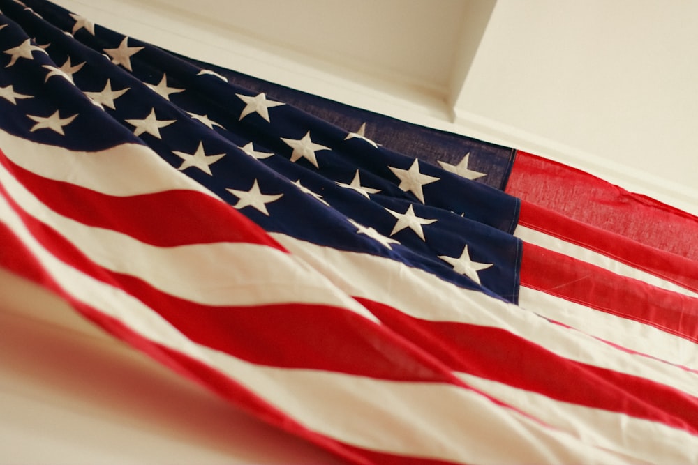 an american flag hanging on a wall