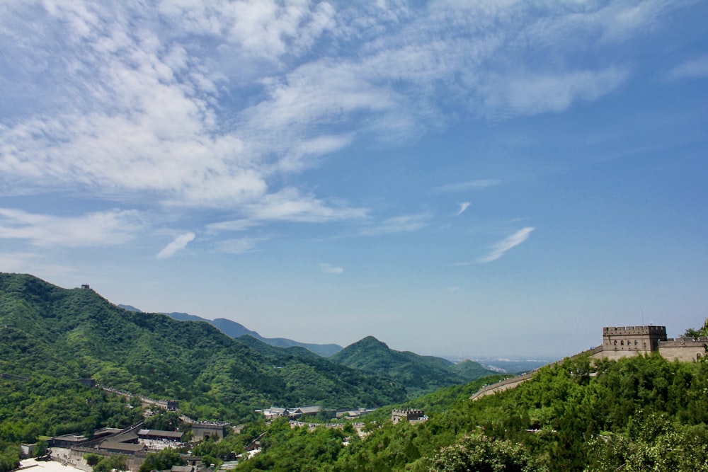 a scenic view of a mountain with a castle in the distance