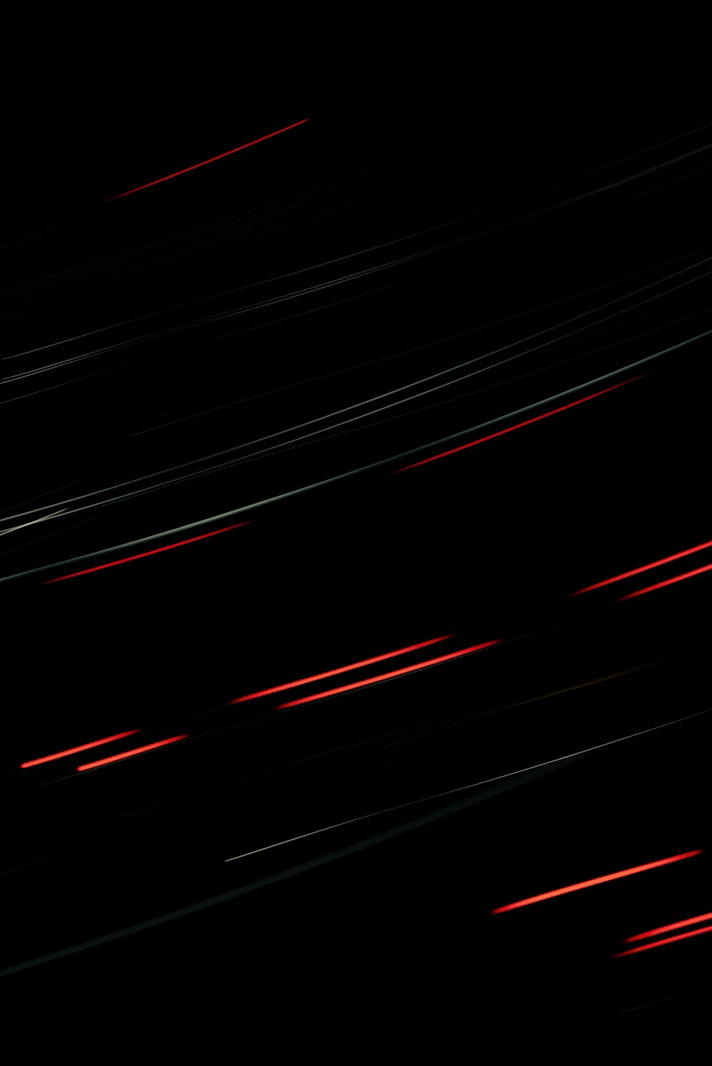 a black background with red streaks of light