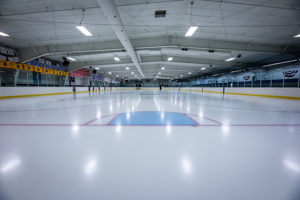 an indoor ice rink with a hockey goal