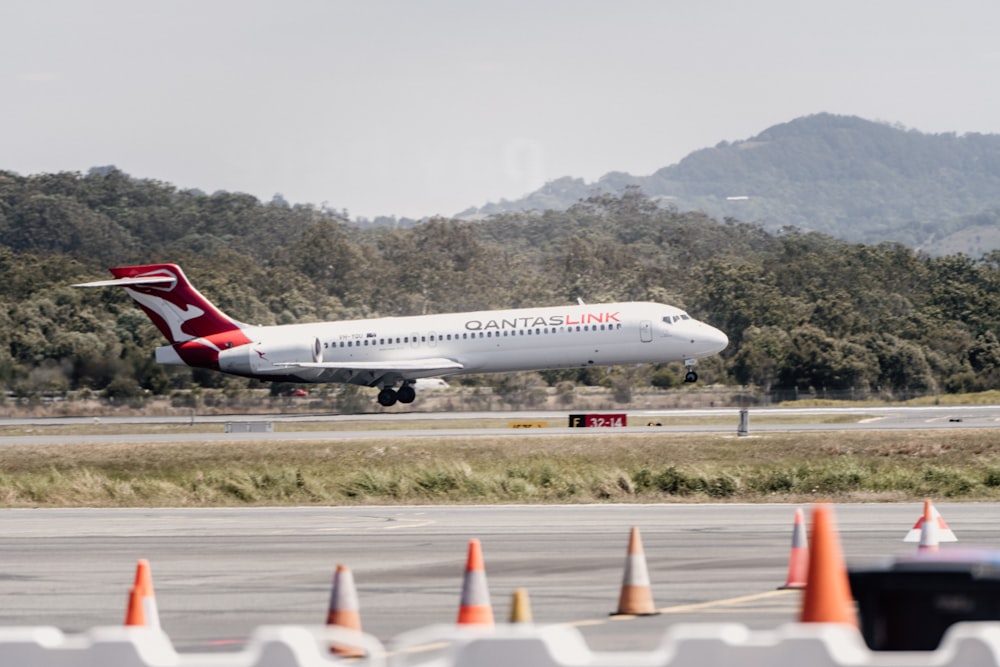 a large jetliner taking off from an airport runway