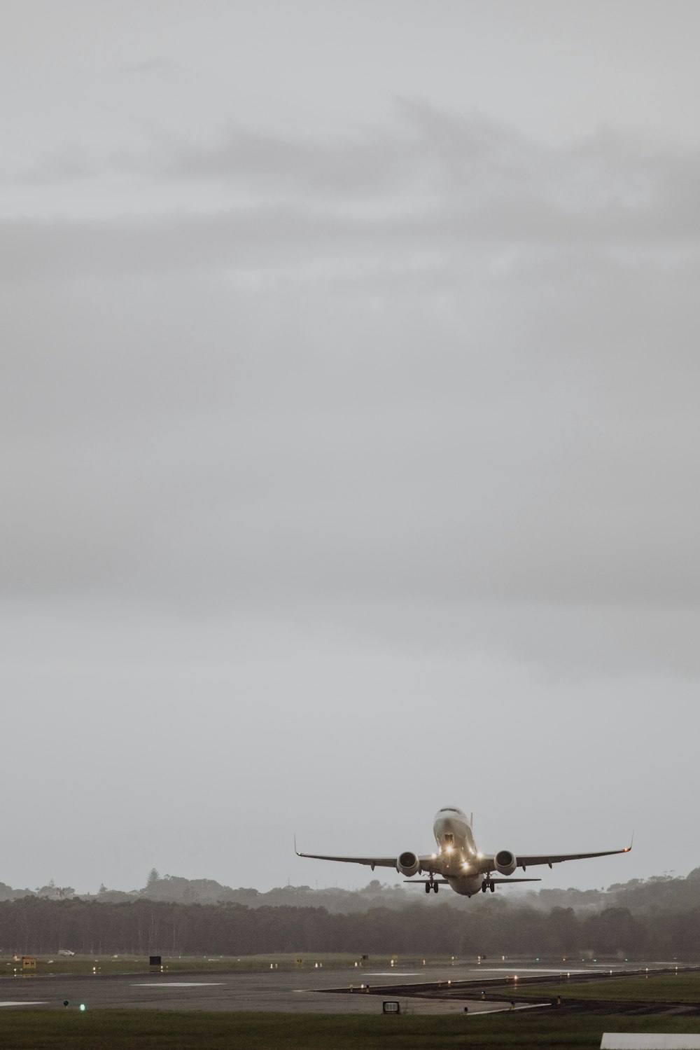 a large jetliner taking off from an airport runway