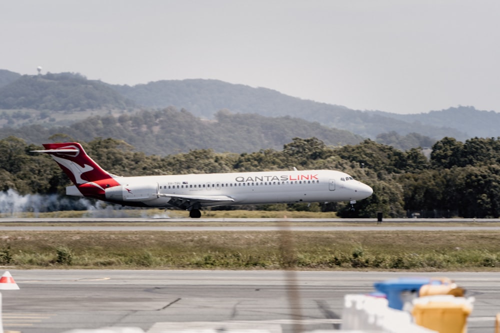 a large jetliner taking off from an airport runway