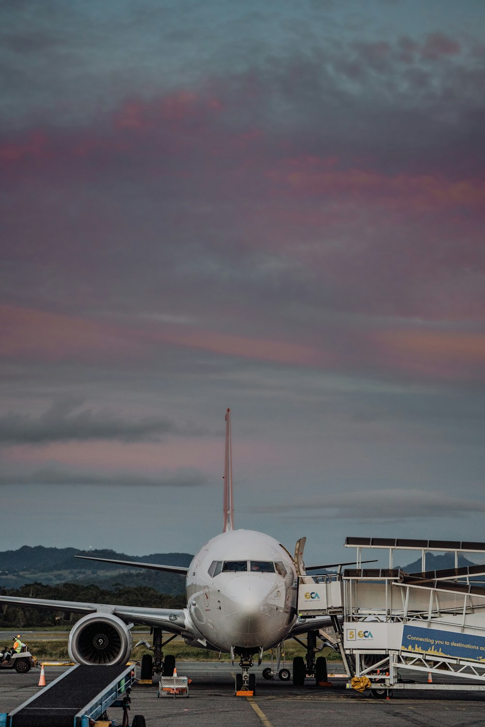 a large jetliner sitting on top of an airport tarmac