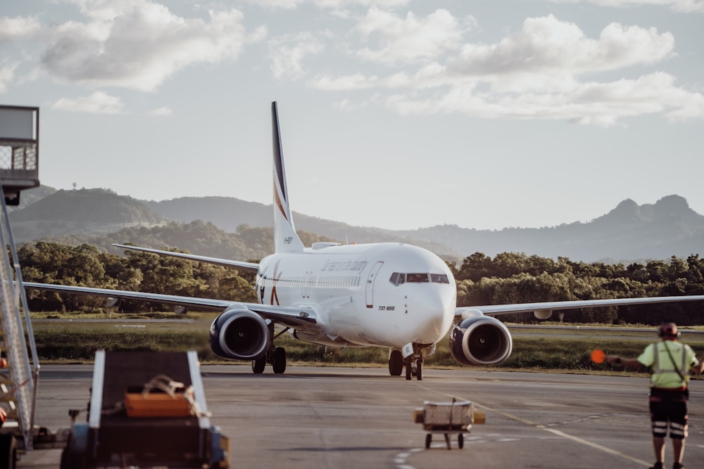 a large jetliner sitting on top of an airport tarmac