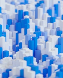 a close up of a blue and white pattern of cubes