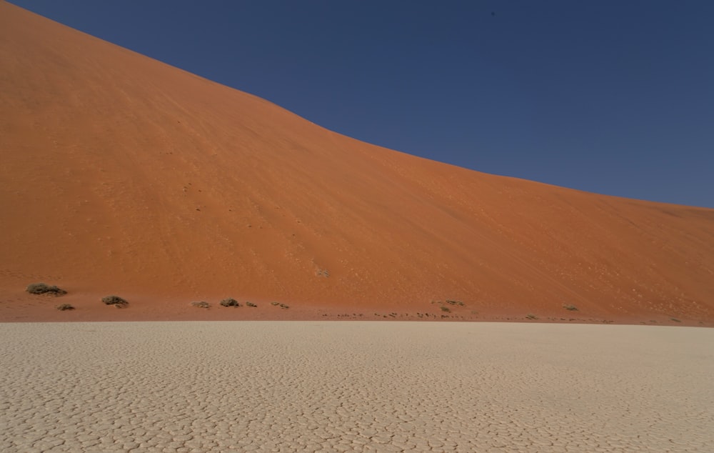 a large sand dune in the middle of a desert