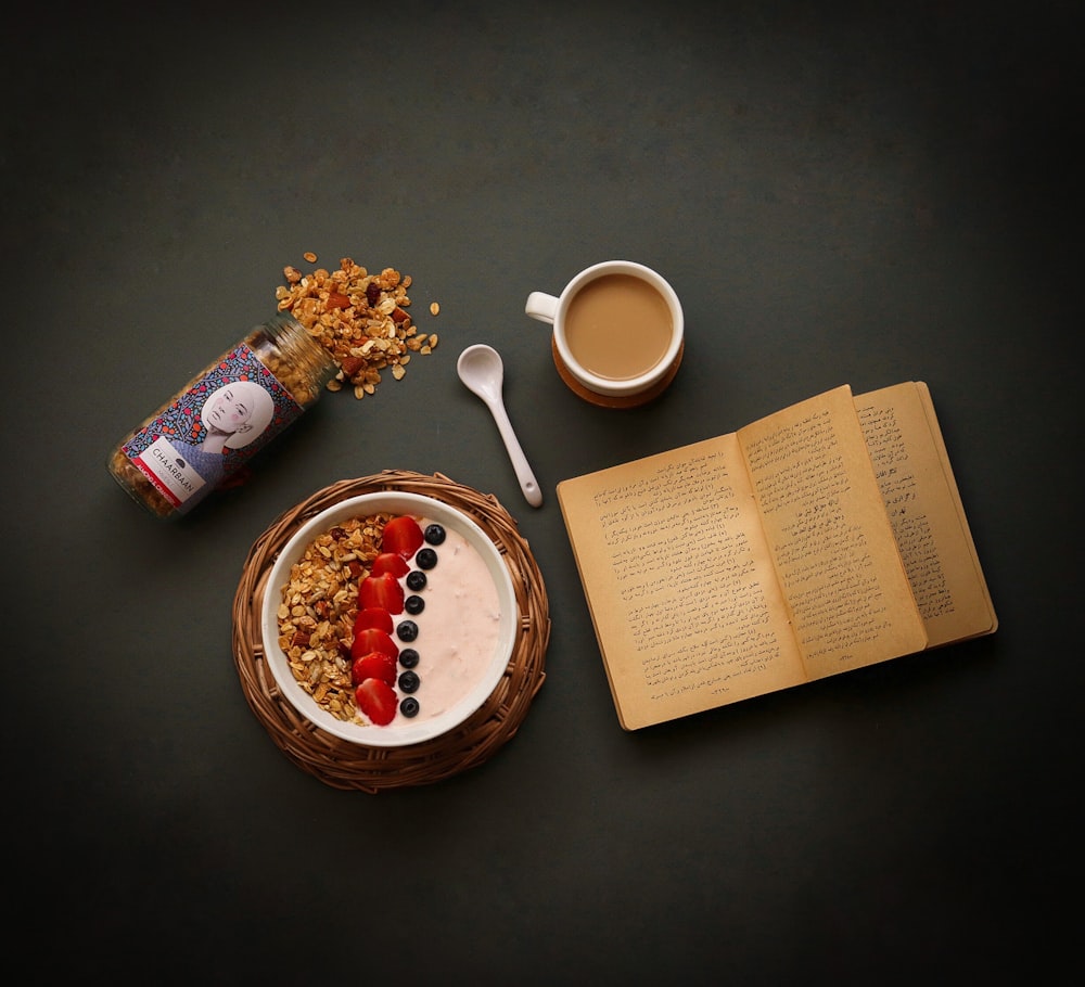 a bowl of cereal and a cup of coffee on a table