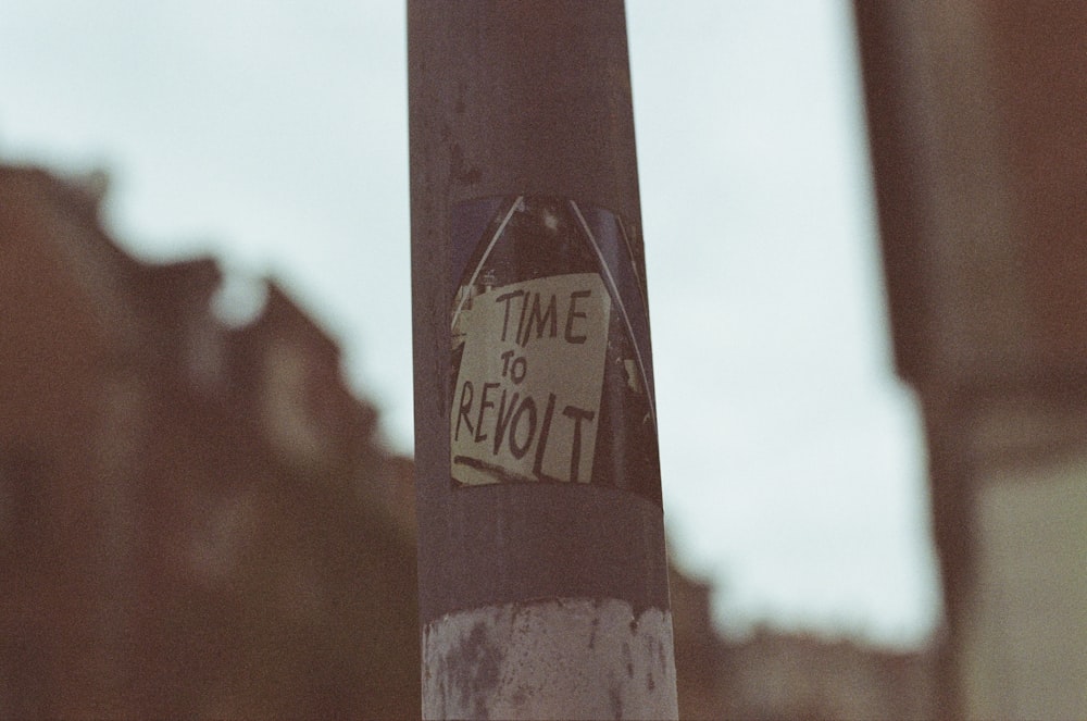 a close up of a street sign on a pole