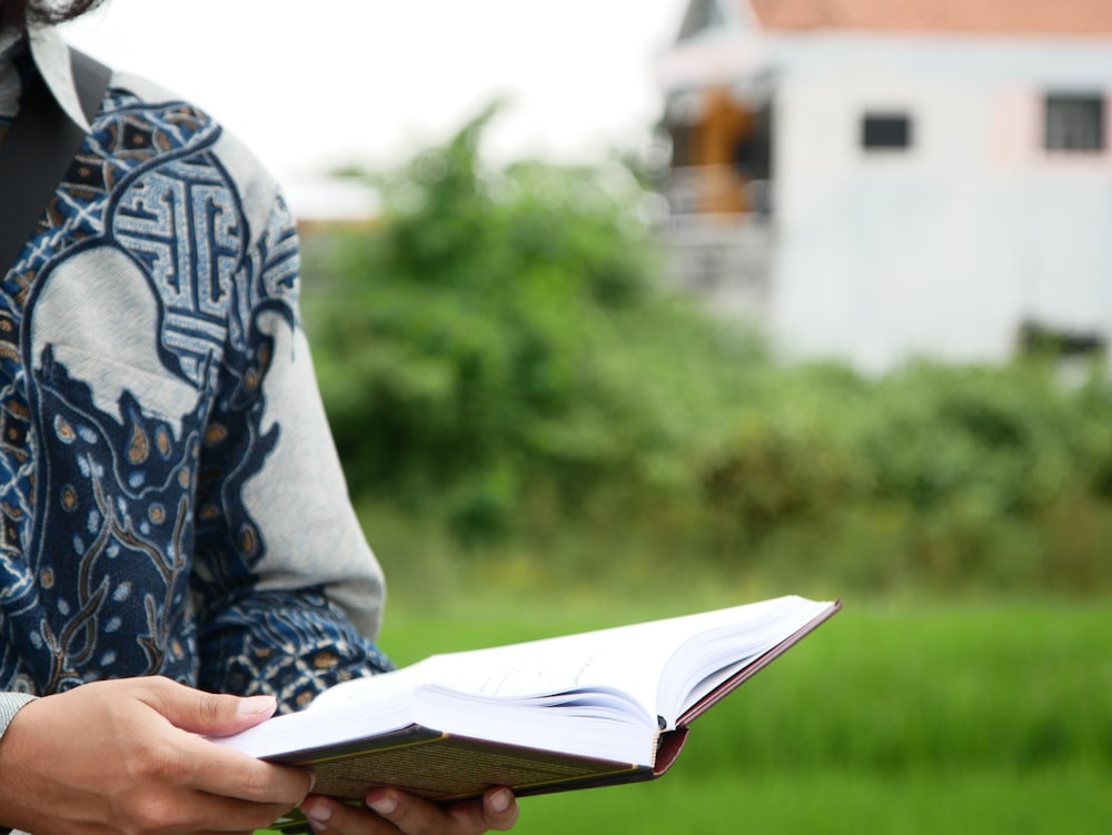 a person holding a book in their hands