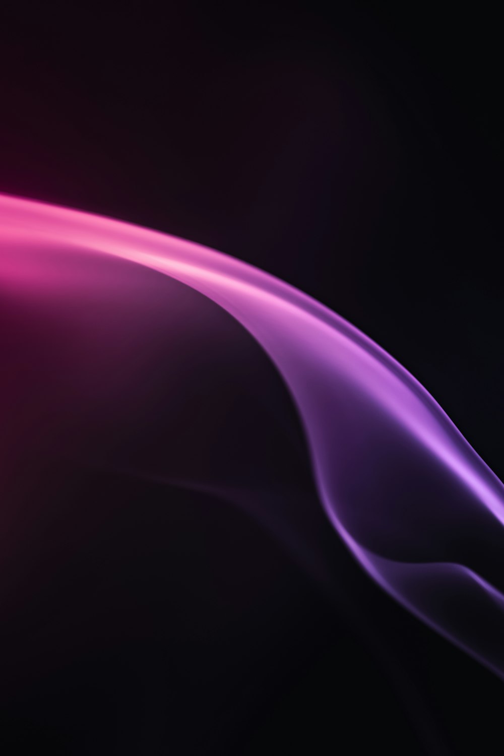 a purple and pink wave of smoke on a black background