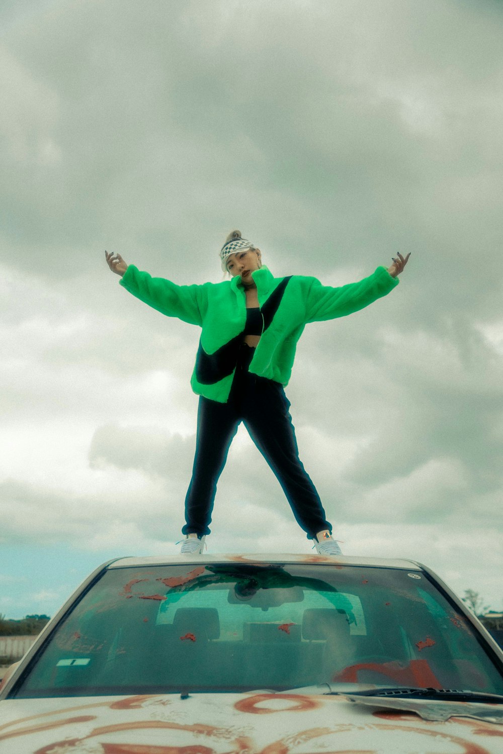 a person standing on top of a car