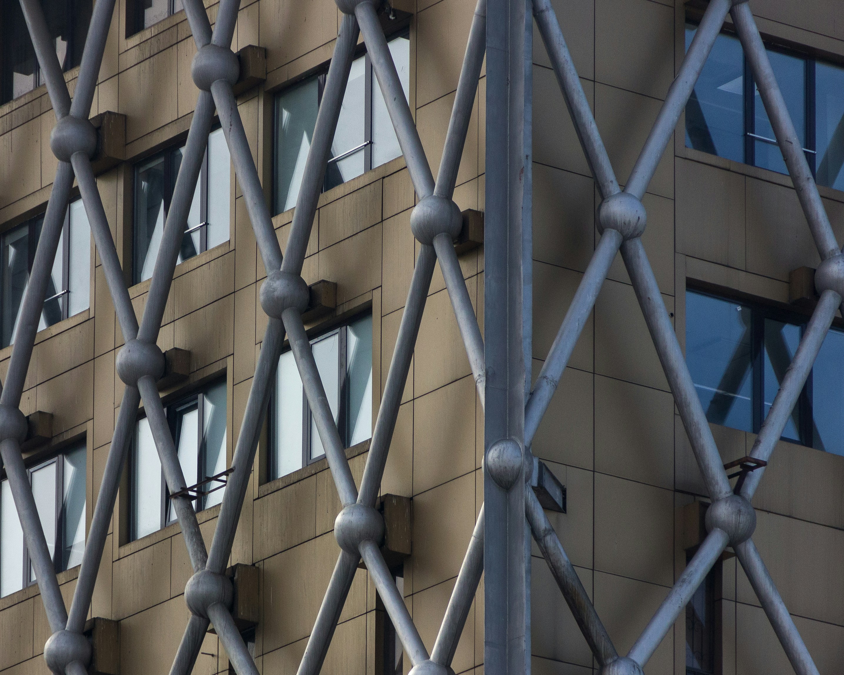 a close up of a building with a metal fence