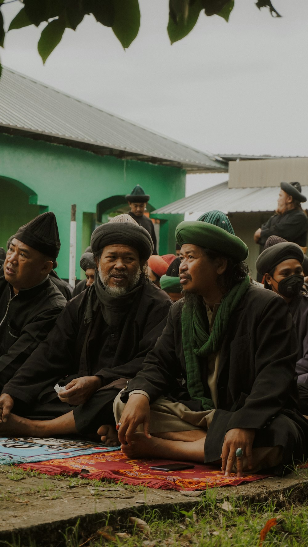 a group of people sitting next to each other