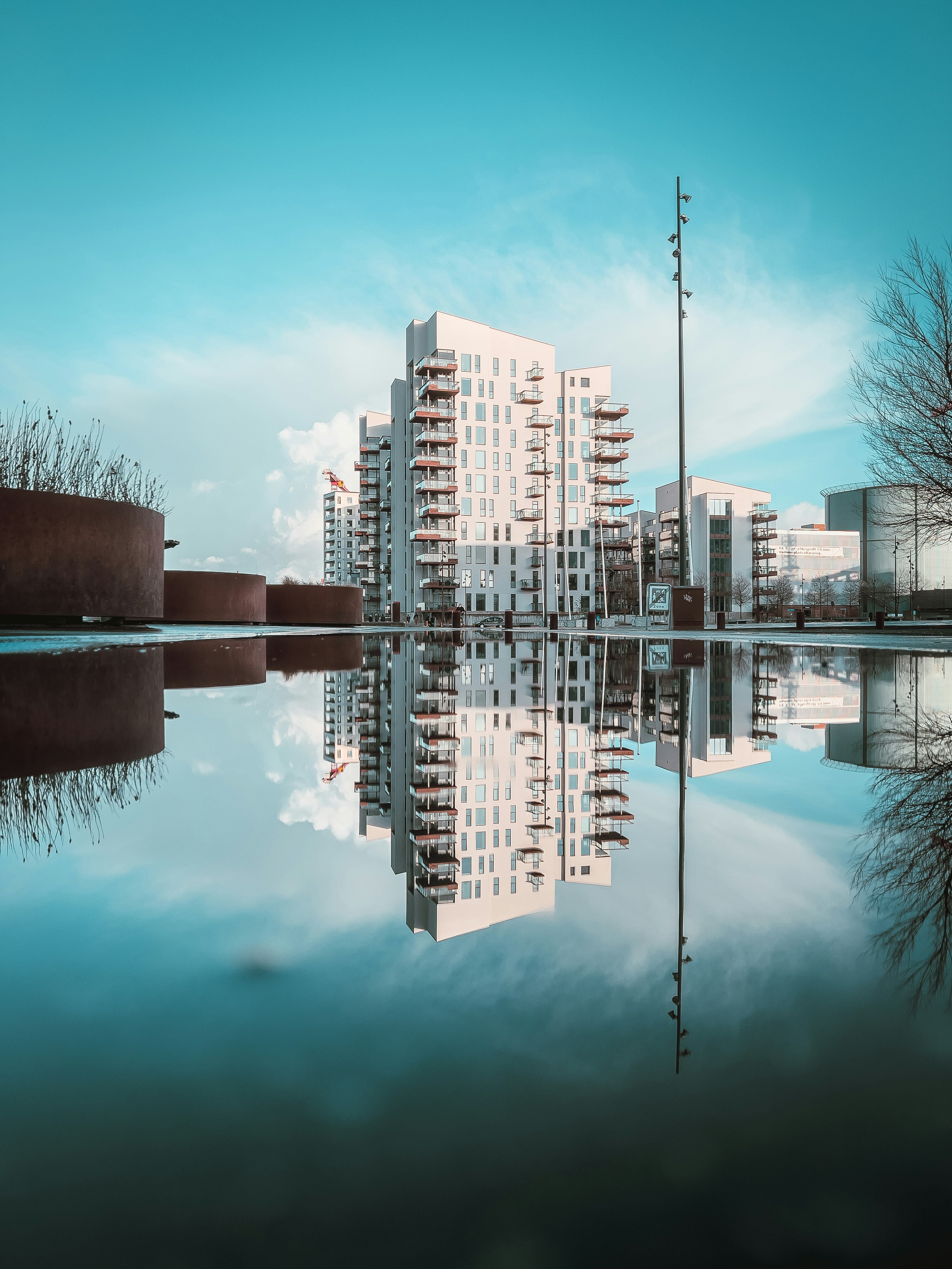 a large body of water with buildings in the background