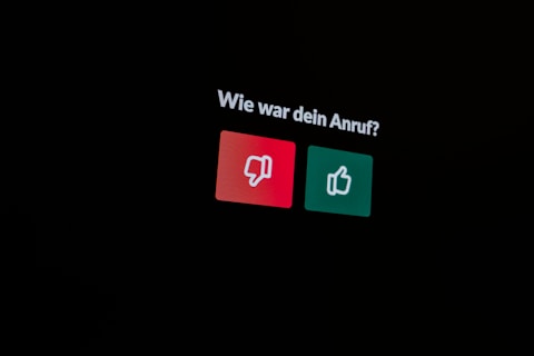 a black background with a red and green sign