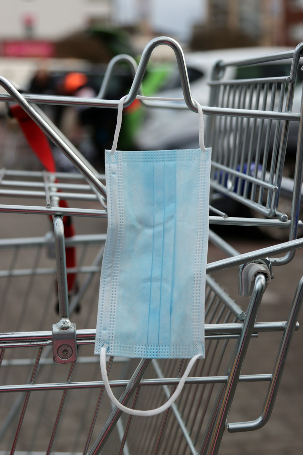 a shopping cart with a face mask on it