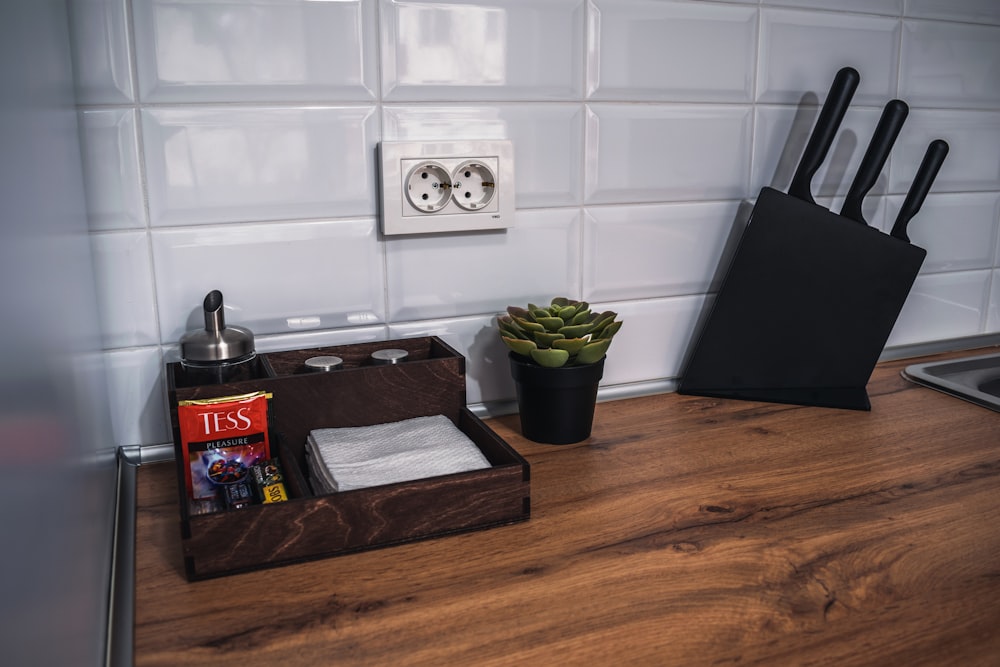 a kitchen counter with a cutting board and knife holder