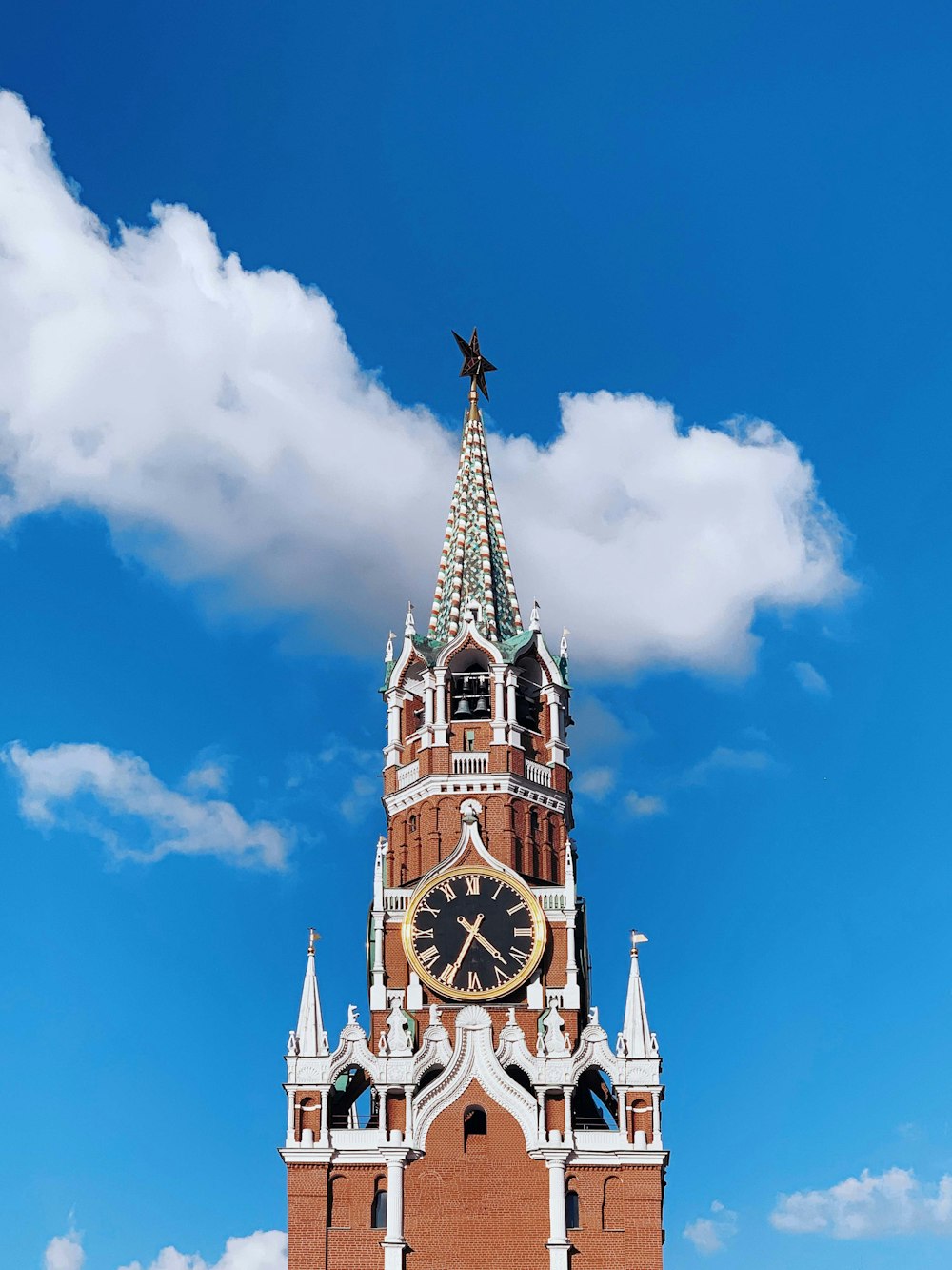 a large clock tower with a sky background