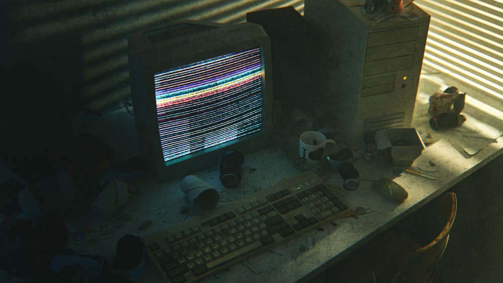 a desktop computer sitting on top of a wooden desk