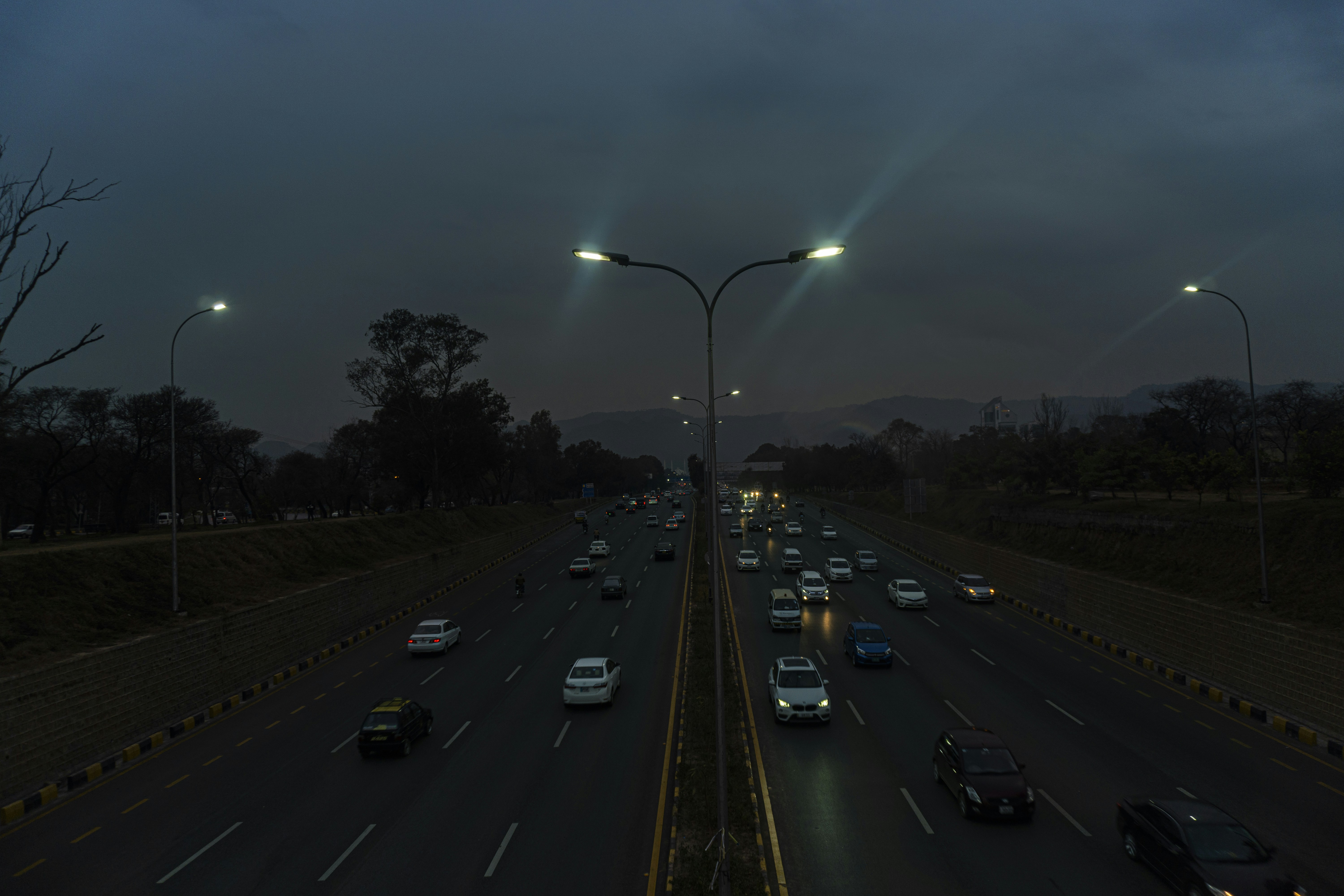 a highway filled with lots of traffic at night