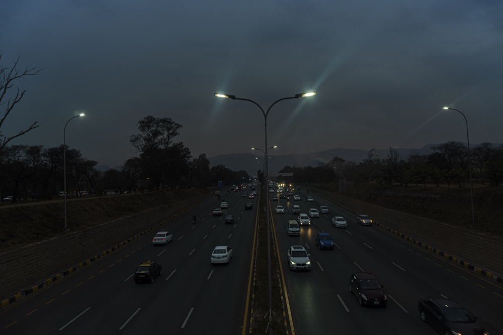 a highway filled with lots of traffic at night