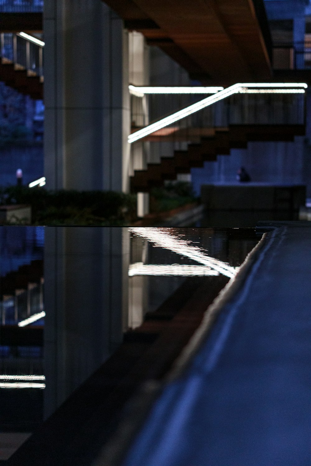 a person walking down a street next to a building