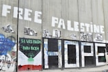 a bunch of graffiti on the side of a building