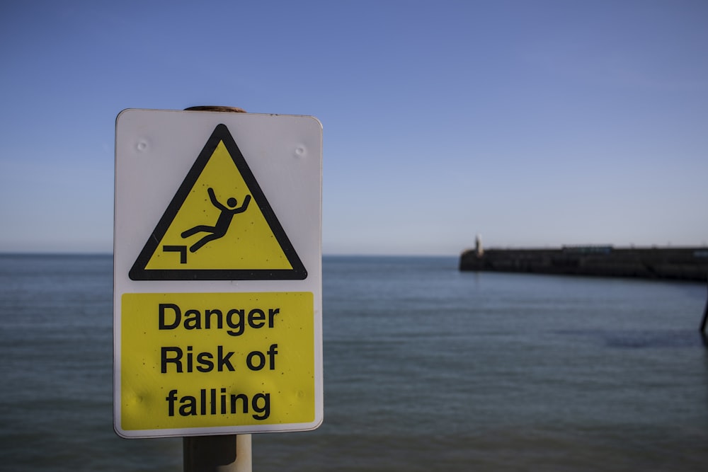 a sign warning of a danger of falling