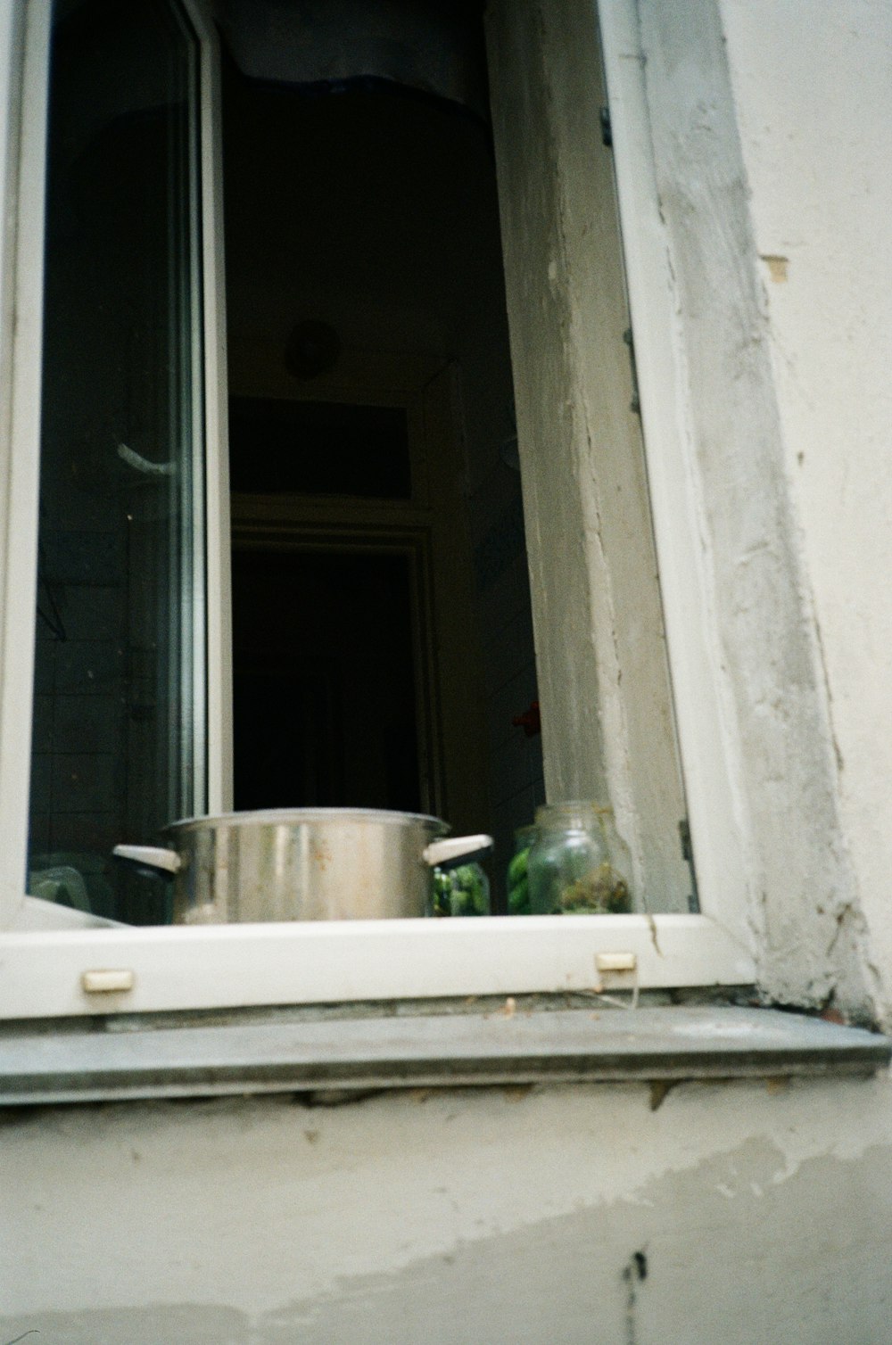 a pan is sitting on a window sill