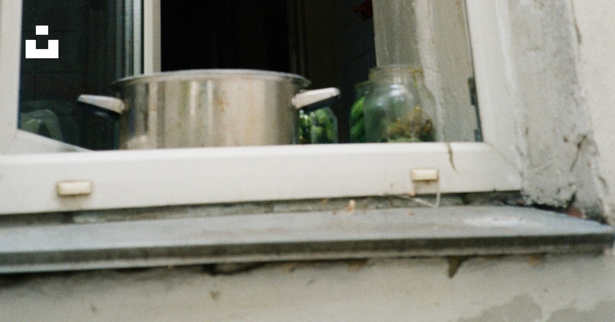 A pan is sitting on a window sill photo – Free Home Image on Unsplash
