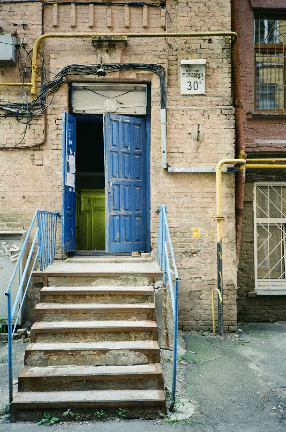 a set of steps leading to a blue door