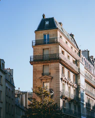 a tall building with balconies and balconies on the top of it