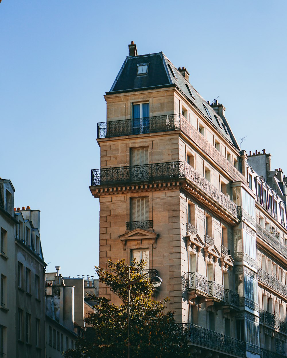 a tall building with balconies and balconies on the top of it